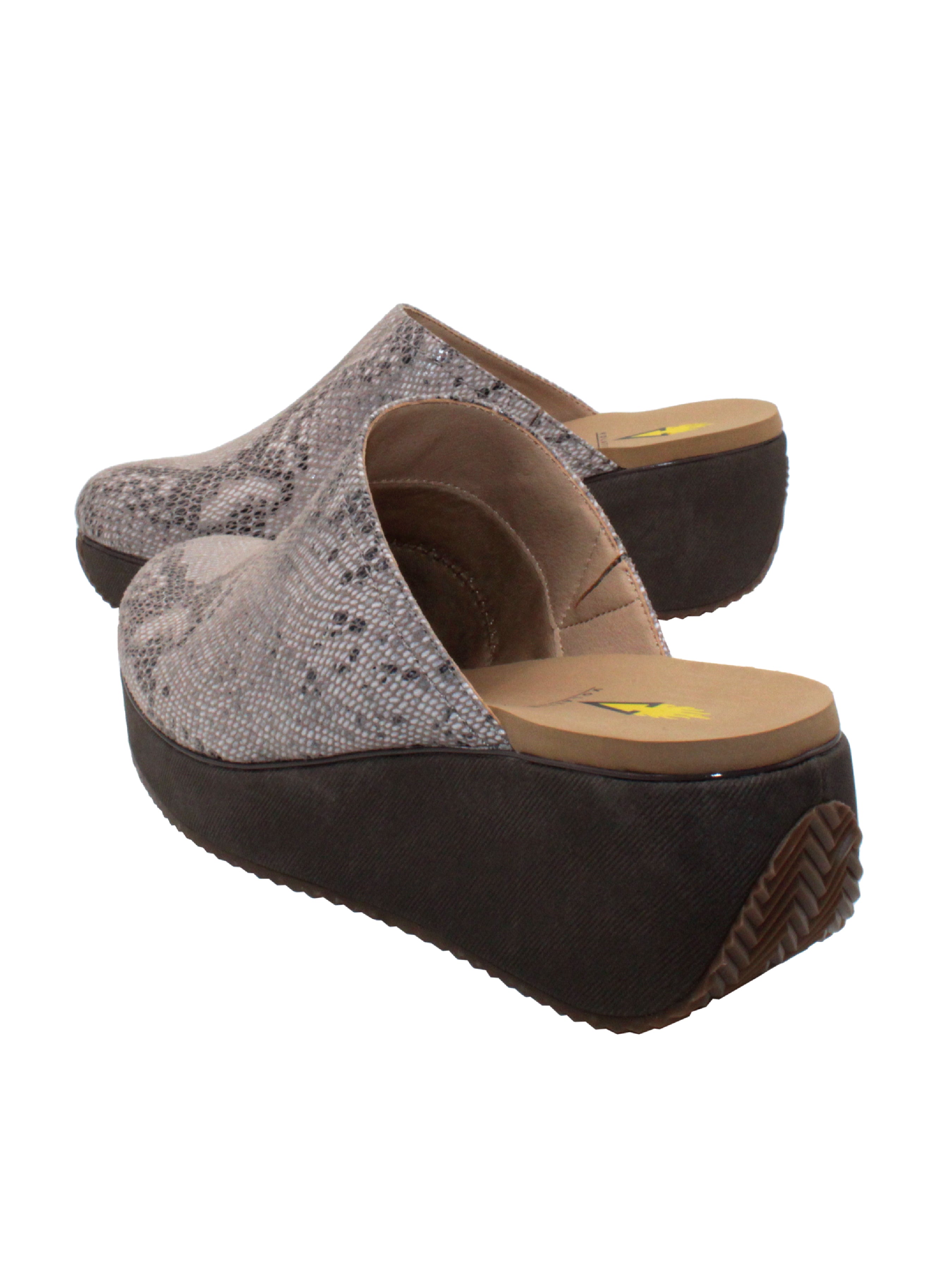 Volatile’s effortless ‘Belmont’ mule gives you a lift with an easy to wear wedge that is balanced by a platform, making it comfortable to walk in all day. The easy step-in design has an elastic gore for a little extra give and comfort. Featuring our signature ultra-comfort EVA insole and stationed on our classic rubber traction outsole for added stability. Pair these mules with pants or dresses alike.