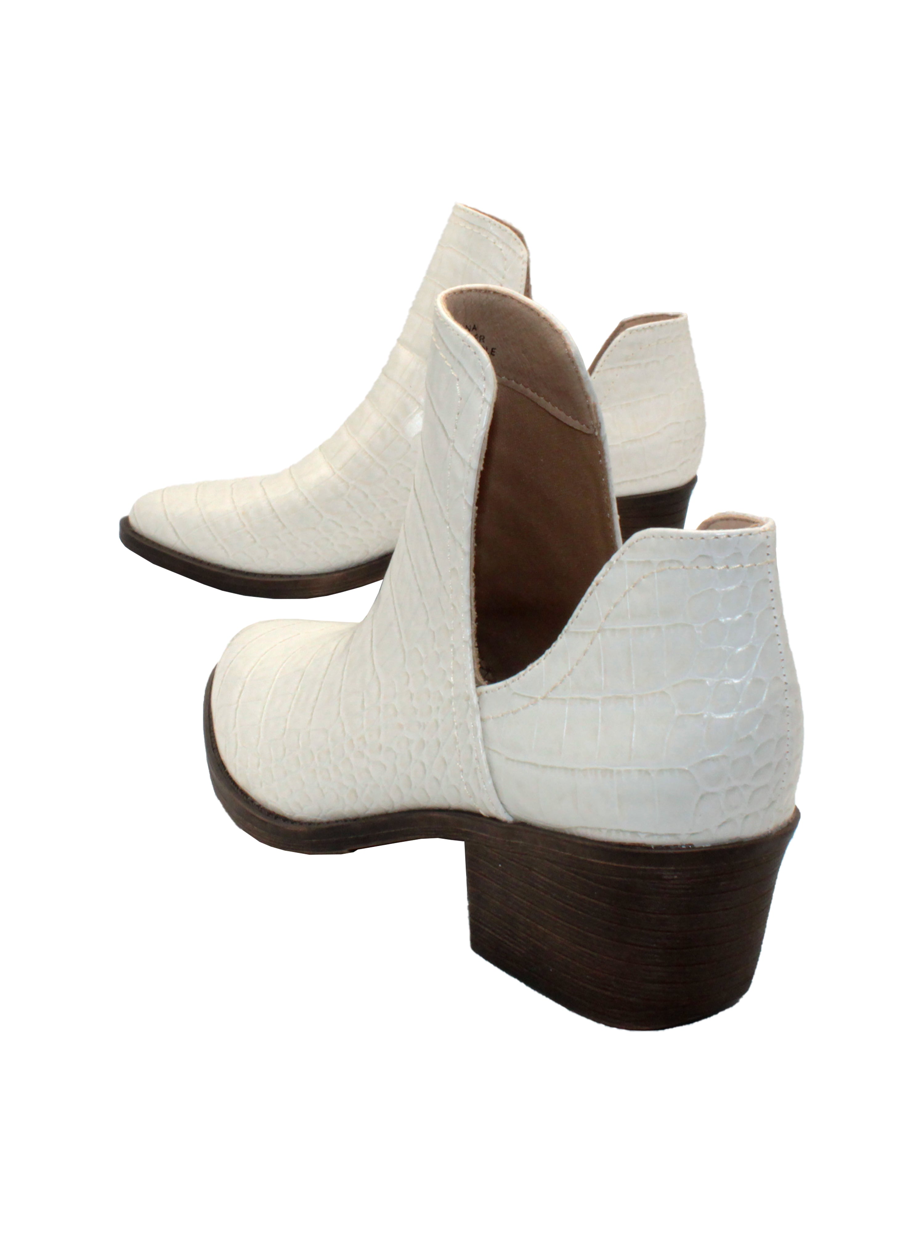 Our fan favorite bone croco CHRONICLE bootie by Volatile has been crafted in exotic materials, embossed faux croco or multicolored faux snake, for the new fall season. The upper features an attractive open shank that complement dresses and jeans alike.  back